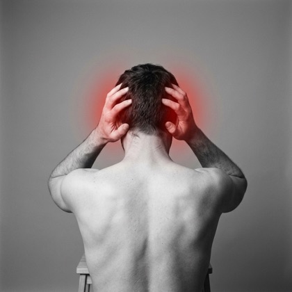 Man holding his head, red highlight showing headache pain