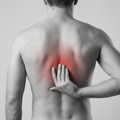 Man reaching for his mid back, red highlight showing upper back pain