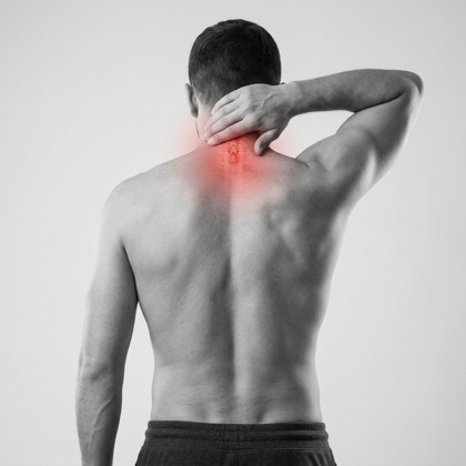 Man gripping the back of his neck, red highlight showing neck pain
