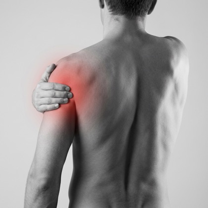 Man holding his shoulder, red highlight showing shoulder pain